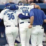 Jose being helped off the field moments later (Toronto Star)