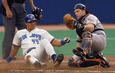 Jose is tagged out at home on 6/12/98 (CP)