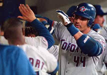 Jose after hitting his 31st homer of the year, on 8/1/98 (AP)