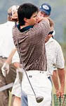 Jose swinging a golf club at a charity golf tournament on 8/10/98 