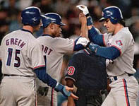 Jose being congratulated after his 42nd homer of the year on 9/10/98 (AP) 