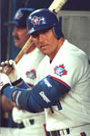 Jose getting ready to take a practice swing in the dugout 