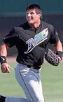 Jose warming up in the outfield on 3/10/99 (SP Times)