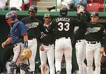 Jose after his 2nd homer of the day - a Grand Slam on 3/15/99 (Toronto Star)