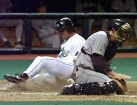 Jose sliding safely into home on 4/23/99 (AP)