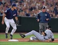 Jose sliding safely into third base on 5/15/99 (AP)