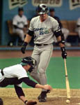 Jose watches catcher Dan Wilson reach for a ball that got away on 5/28/99 (AP)